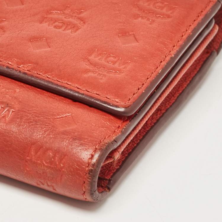 Pre Owned MCM Brick Red Visetos Embossed Leather Trifold Wallet