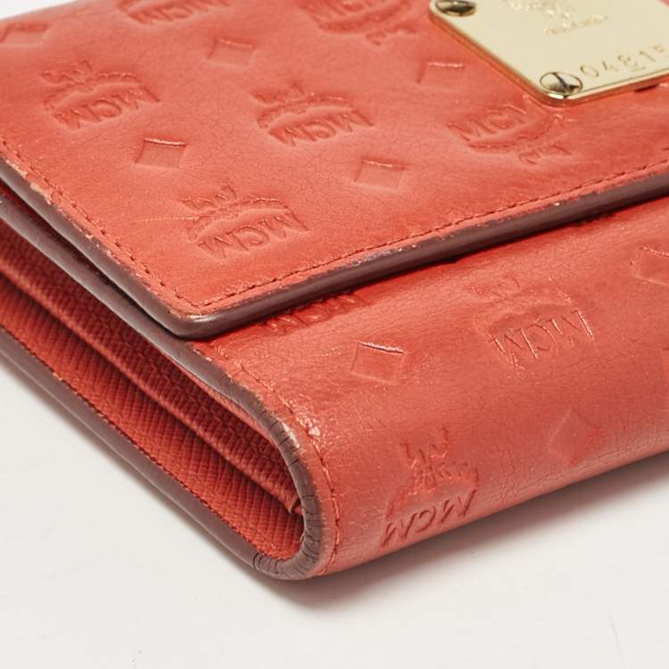Pre Owned MCM Brick Red Visetos Embossed Leather Trifold Wallet