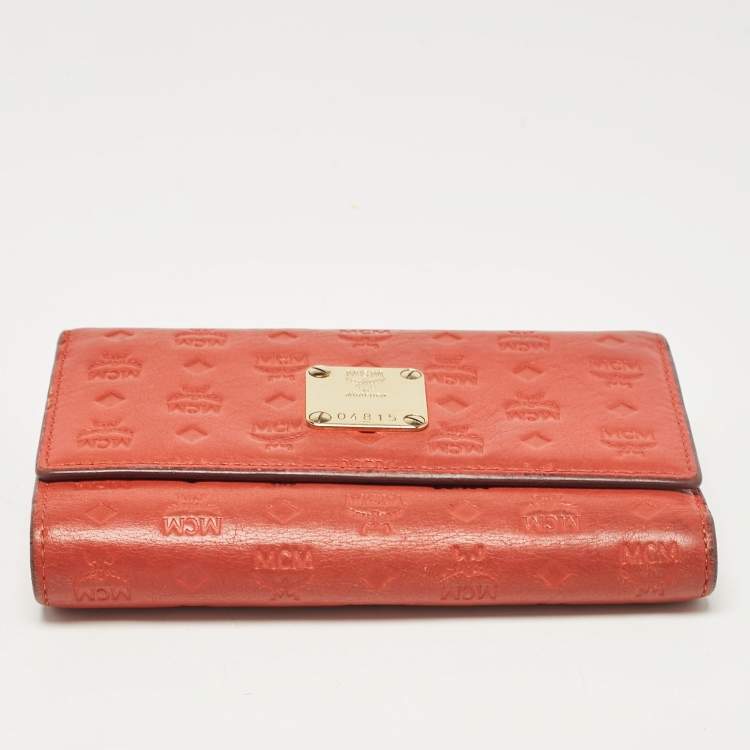 Pre Owned MCM Brick Red Visetos Embossed Leather Trifold Wallet