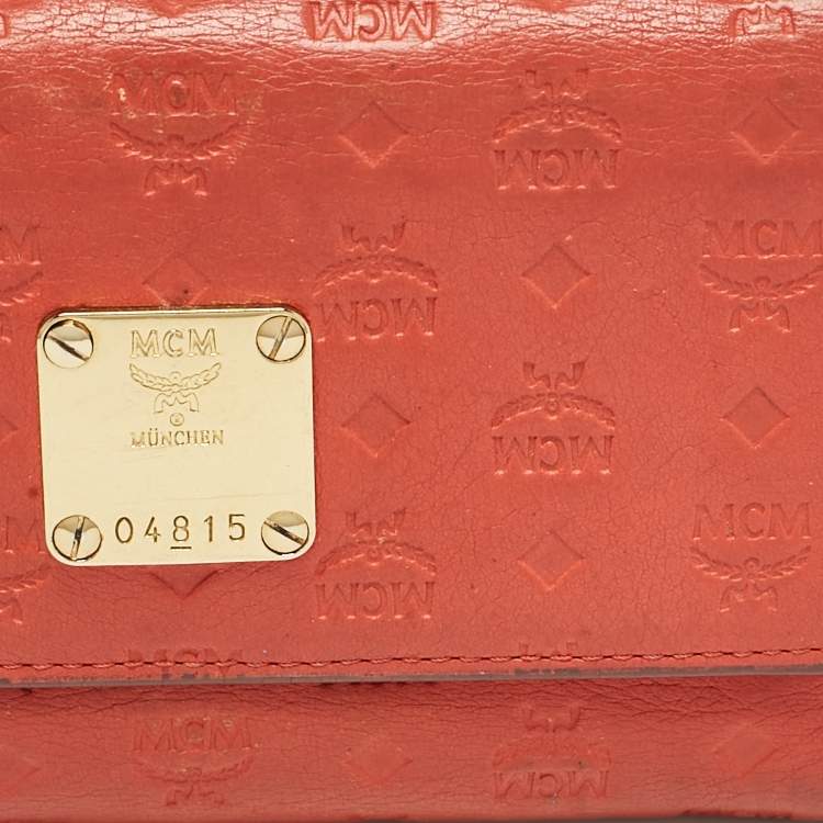 Pre Owned MCM Brick Red Visetos Embossed Leather Trifold Wallet