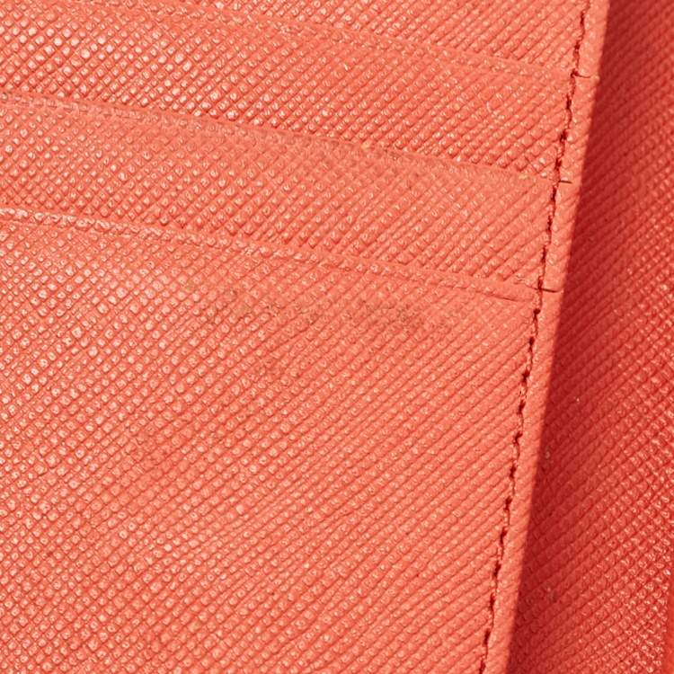 Pre Owned MCM Brick Red Visetos Embossed Leather Trifold Wallet