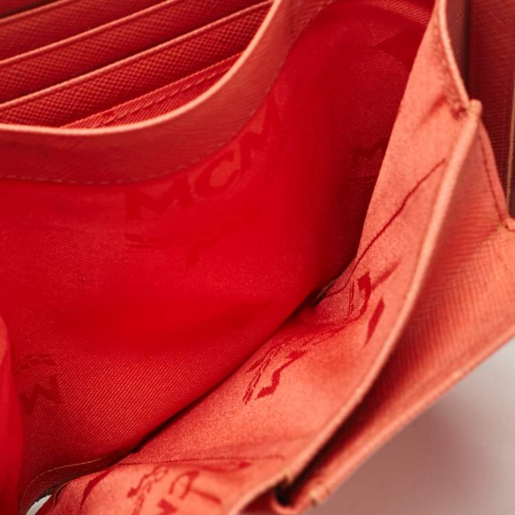 Pre Owned MCM Brick Red Visetos Embossed Leather Trifold Wallet