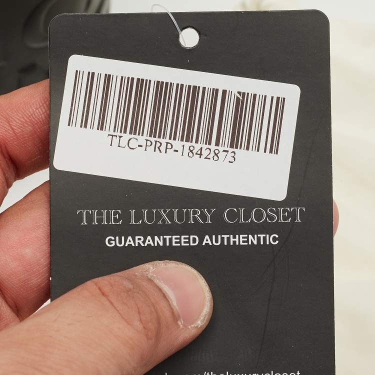 Pre Owned MCM Black Logo Embossed Leather Cylinder Bag