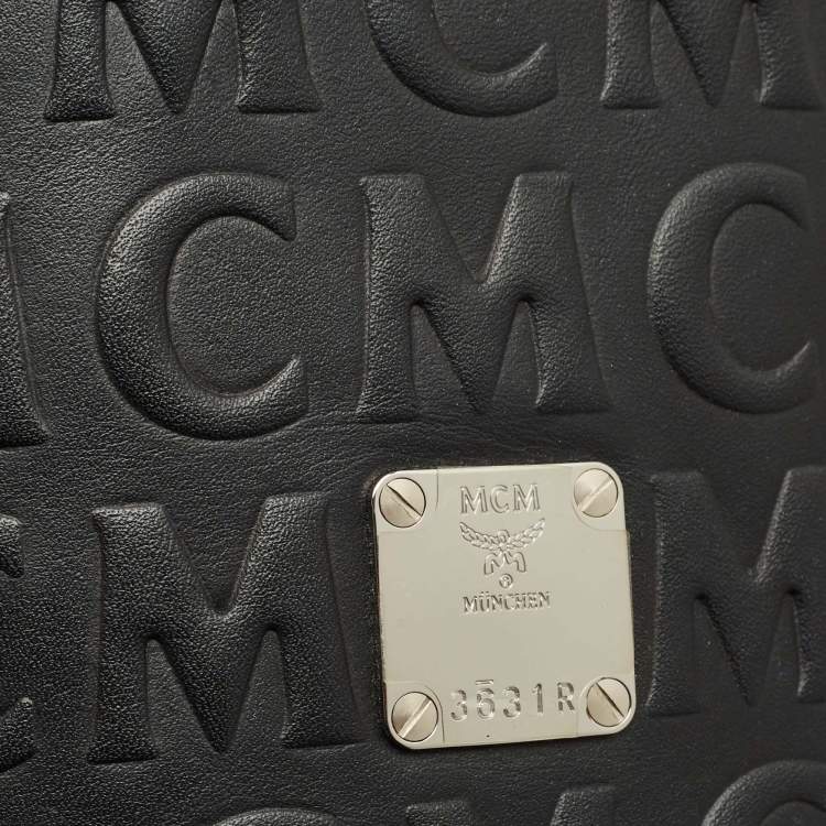Pre Owned MCM Black Logo Embossed Leather Cylinder Bag