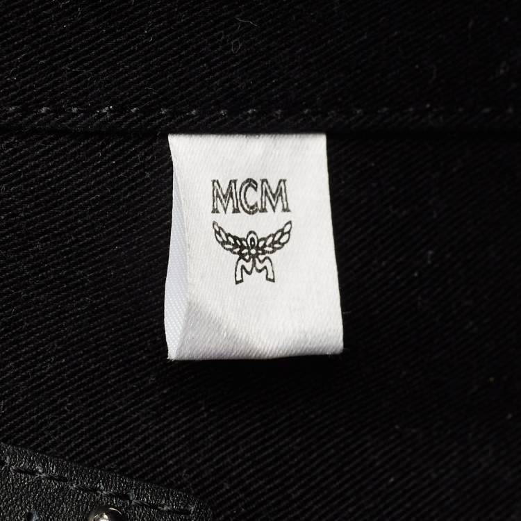 Pre Owned MCM Black Logo Embossed Leather Cylinder Bag