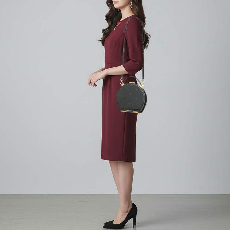 Pre Owned MCM Black Studded Berlin Black Coated Canvas Round Bag