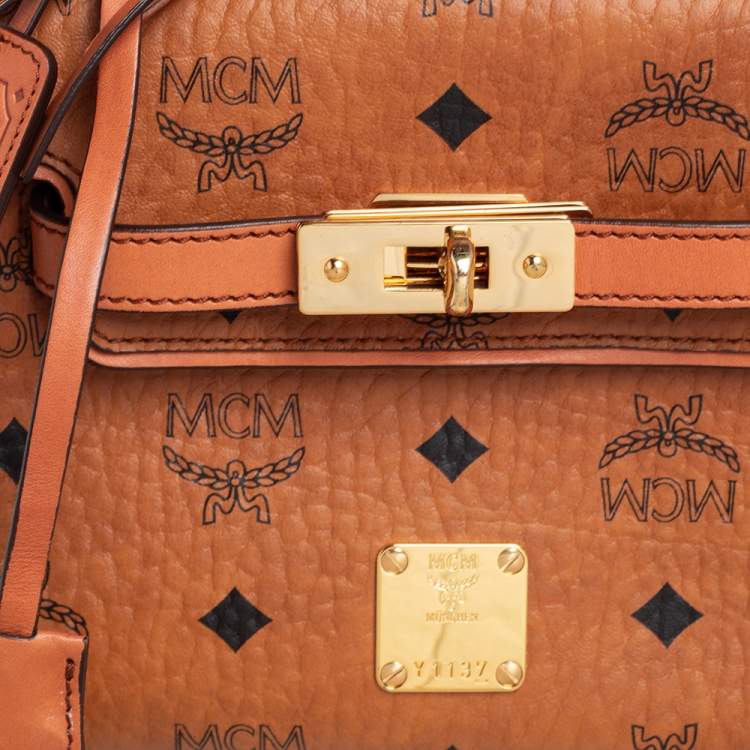 Pre Owned MCM Brown Visetos Coated Canvas and Leather Embellished Mini Heritage Top Handle Bag