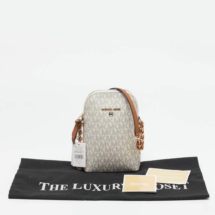 Pre Owned Michael Kors White Signature Coated Canvas and Leather Small Jet Set Charm NS Phone Crossbody Bag