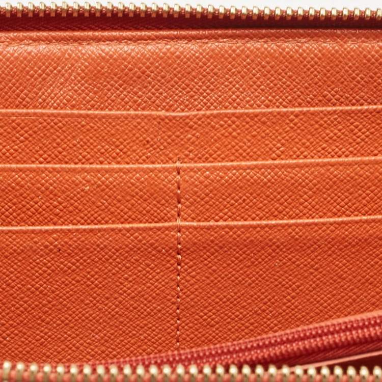 Pre Owned Michael Kors Orange/Brown Snakeskin Embossed Leather Jet Set Zip Around Wallet