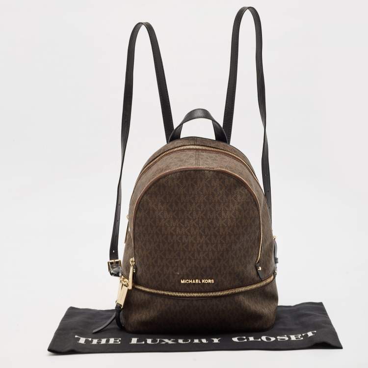 Pre Owned Michael Kors Brown Signature Coated Canvas and Leather Medium Rhea Backpack
