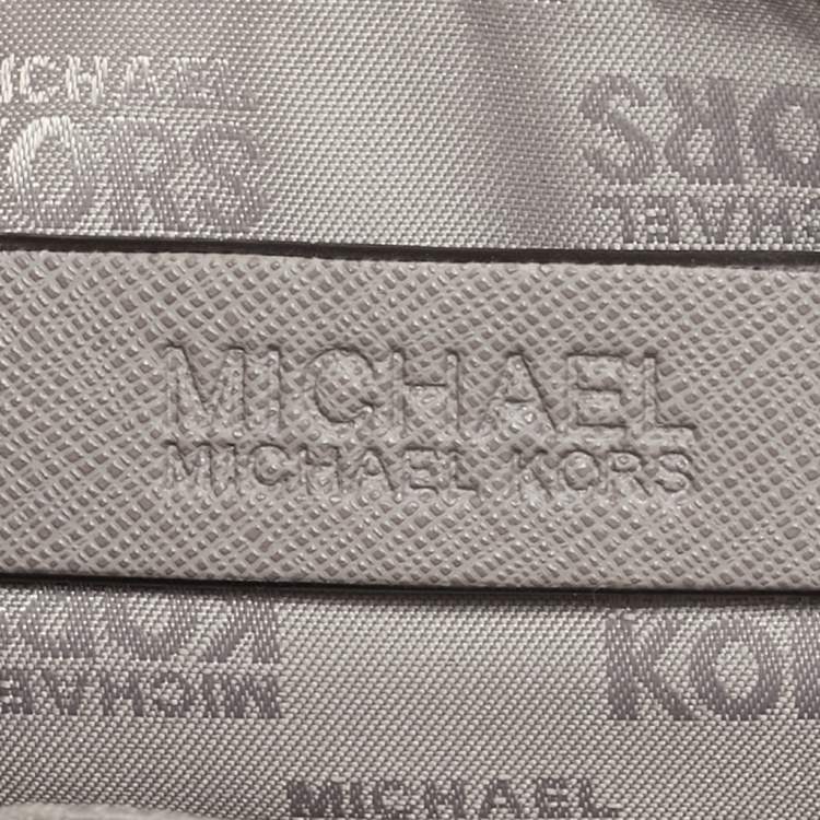 Pre Owned Michael Kors Grey Perforated Quilted Leather Mini Rhea Backpack