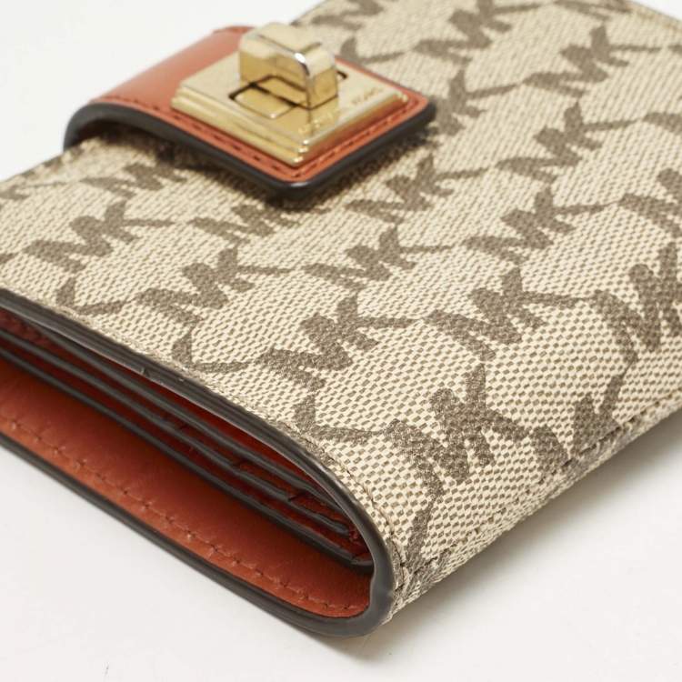 Pre Owned Michael Kors Beige/Orange Signature Coated Canvas Natalie Heritage Compact Wallet