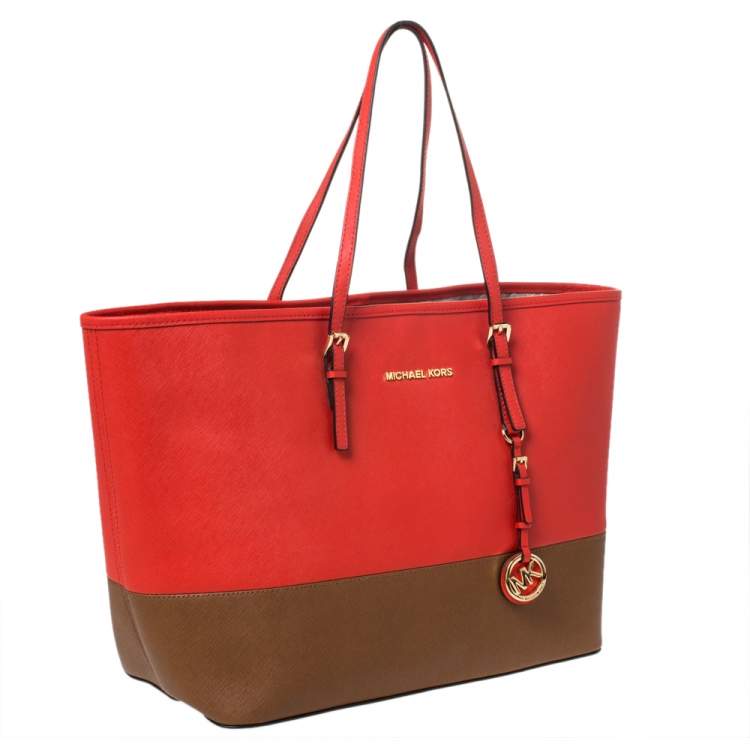 Pre Owned MICHAEL Michael Kors Orange/Brown Leather Jet Set Travel Tote
