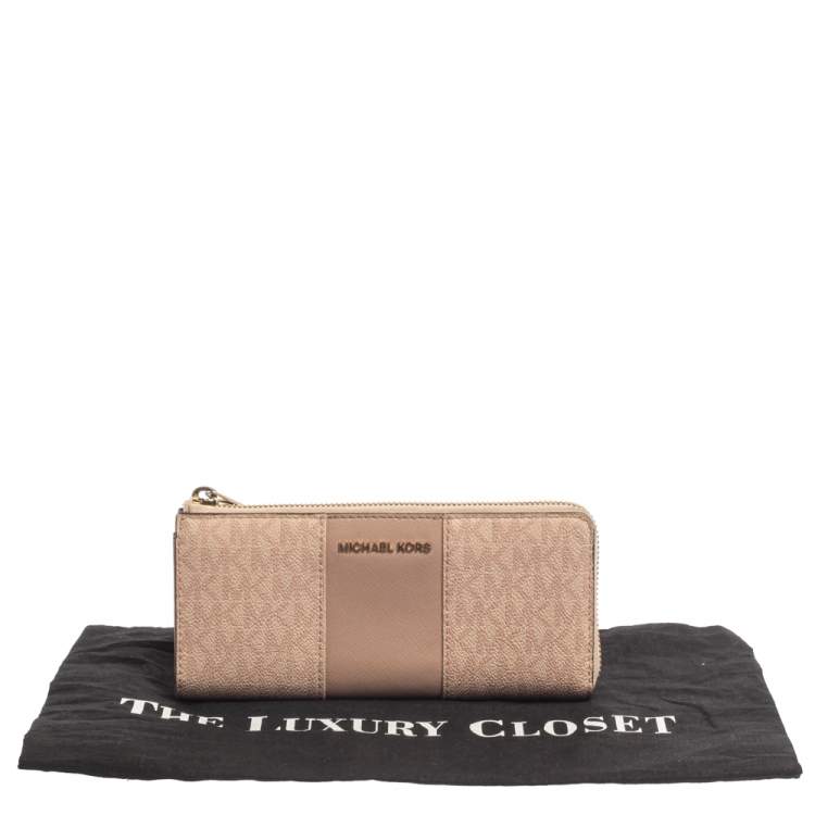 Pre Owned Michael Kors Pink Signature Leather Zip Around Wallet