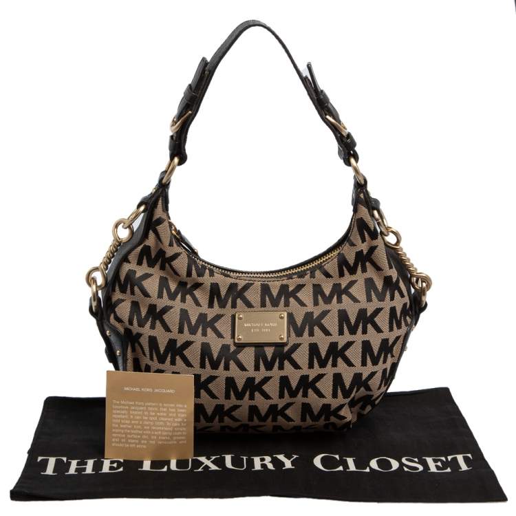 Pre Owned Michael Kors Beige/Black Signature Canvas and Leather Hobo