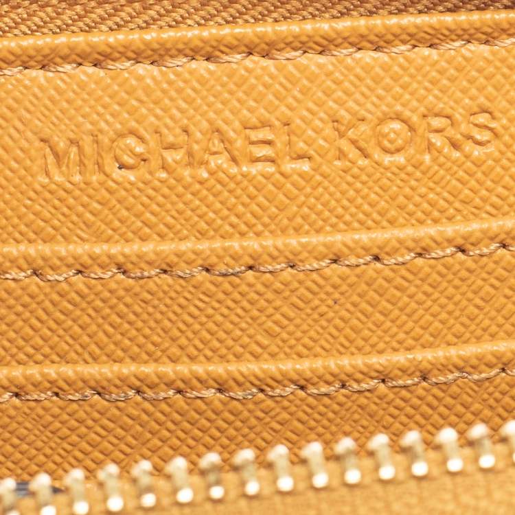 Pre Owned Michael Kors Tan Leather Zip Around Wristlet Wallet.