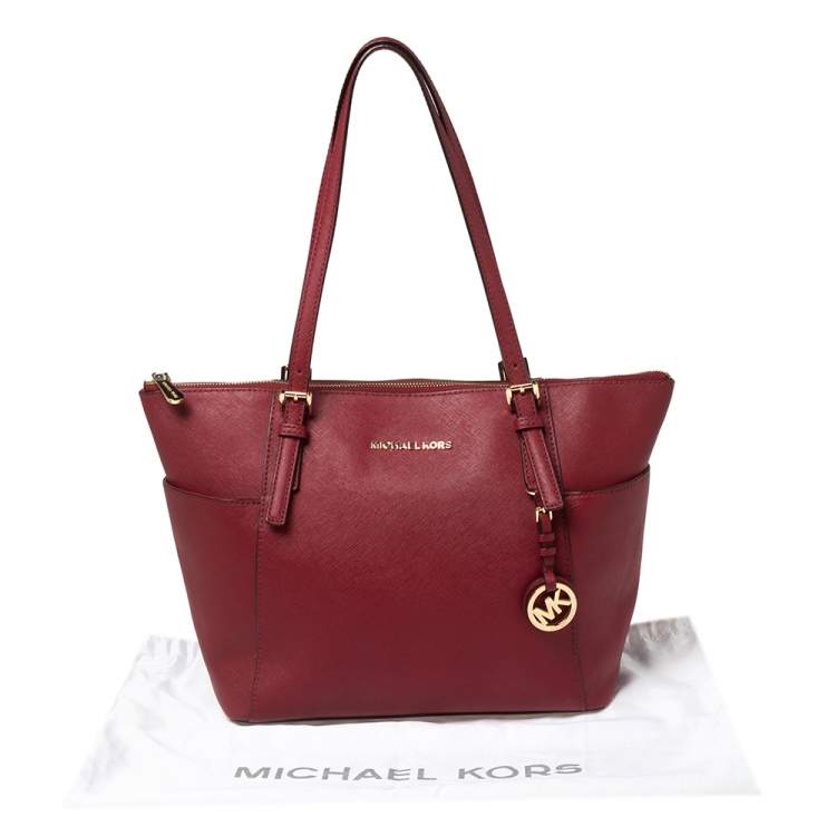 Pre Owned MICHAEL Michael Kors Red Leather Medium Jet Set Top Zip Tote