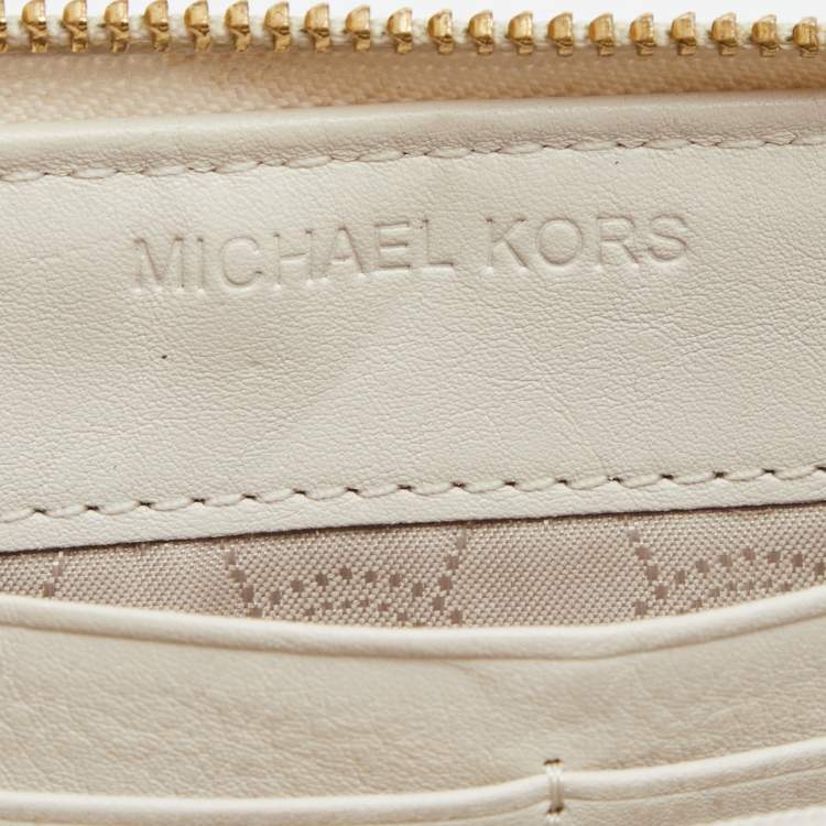 Pre Owned Michael Kors Beige/White Signature Canvas and Leather Zip Around Wallet