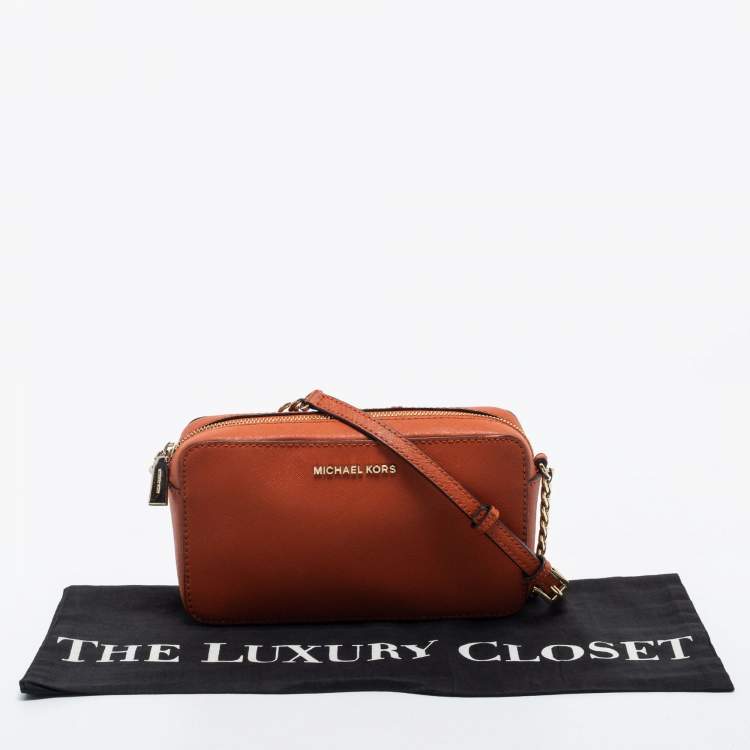 Pre Owned Micheal Kors Rust Brown Leather Zip Jet Set Crossbody Bag