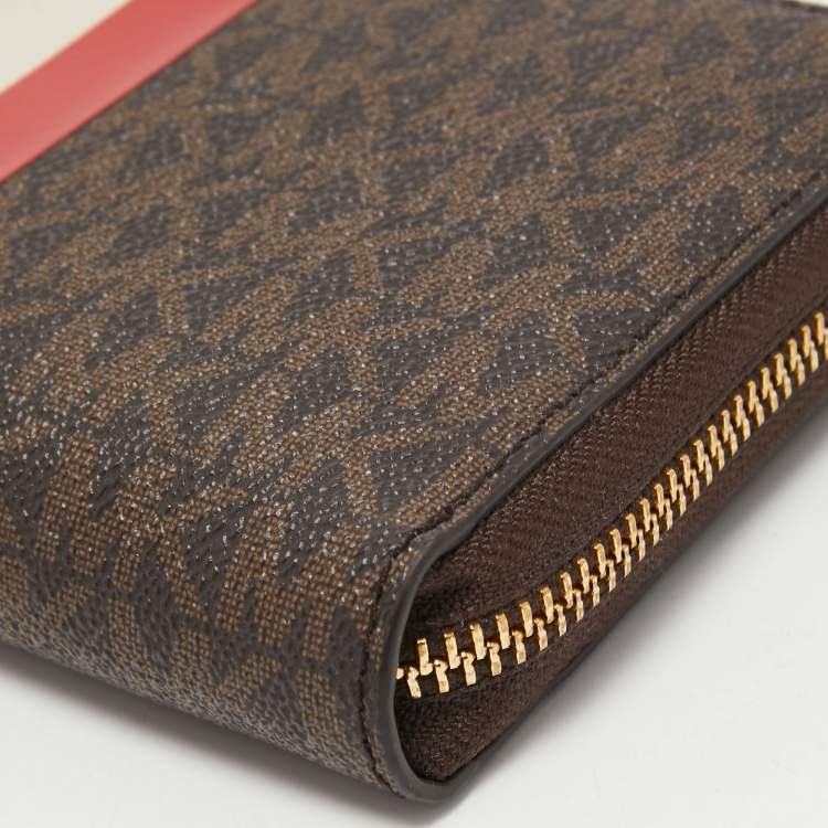 Pre Owned Michael Kors Brown Signature Coated Canvas Zip Around Wristlet Wallet