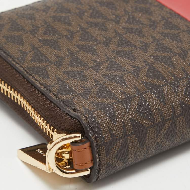 Pre Owned Michael Kors Brown Signature Coated Canvas Zip Around Wristlet Wallet