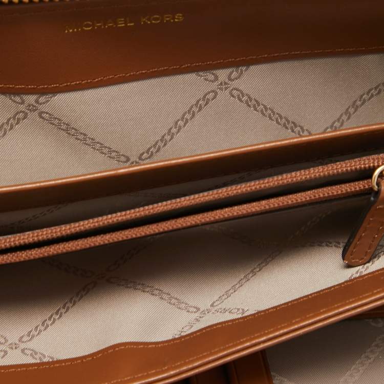 Pre Owned Michael Kors Brown Signature Coated Canvas Zip Around Wristlet Wallet