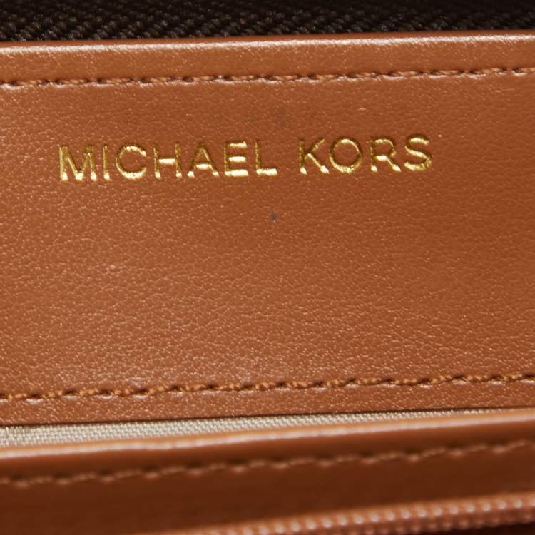 Pre Owned Michael Kors Brown Signature Coated Canvas Zip Around Wristlet Wallet