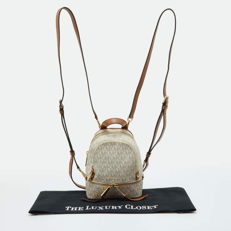 Pre Owned Michael Kors White/Tan Signature Coated Canvas and Leather Mini Rhea Backpack