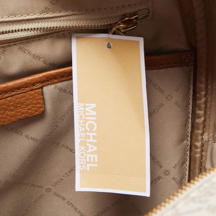 Pre Owned Michael Kors Beige/Tan Signature Coated Canvas and Leather Abbey Backpack