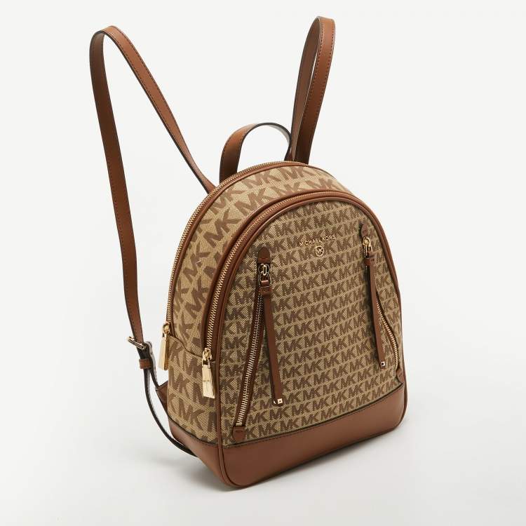 Pre Owned Michael Kors Beige/Tan Signature Canvas and Leather Backpack