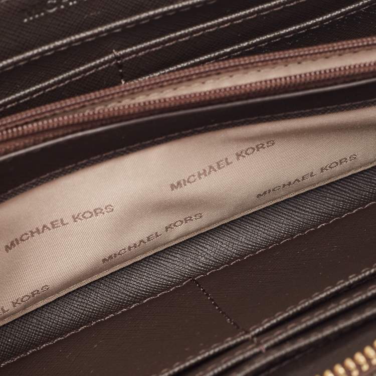 Pre Owned Michael Kors Brown Signature Coated Canvas Logo Zip Around Wallet