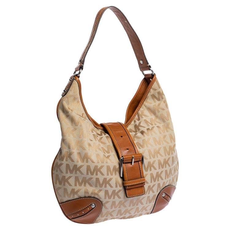 Pre Owned Michael Michael Kors Beige/Tan Signature Canvas and Leather Hobo