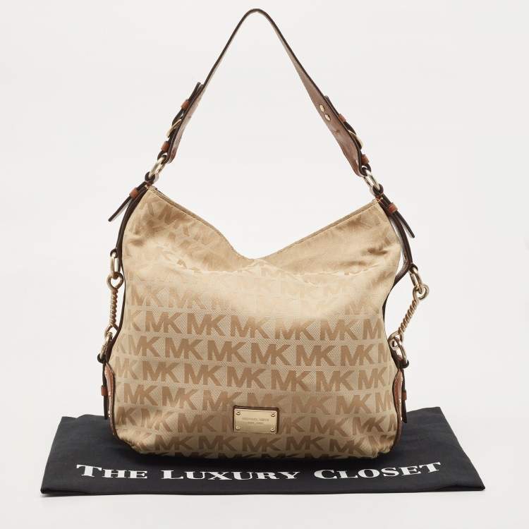 Pre Owned Michael Michael Kors Beige/Brown Signature Canvas and Leather Studded Hobo