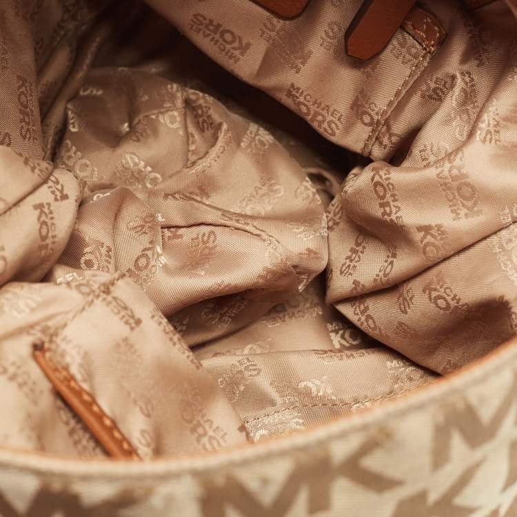 Pre Owned Michael Michael Kors Beige/Brown Signature Canvas and Leather Studded Hobo