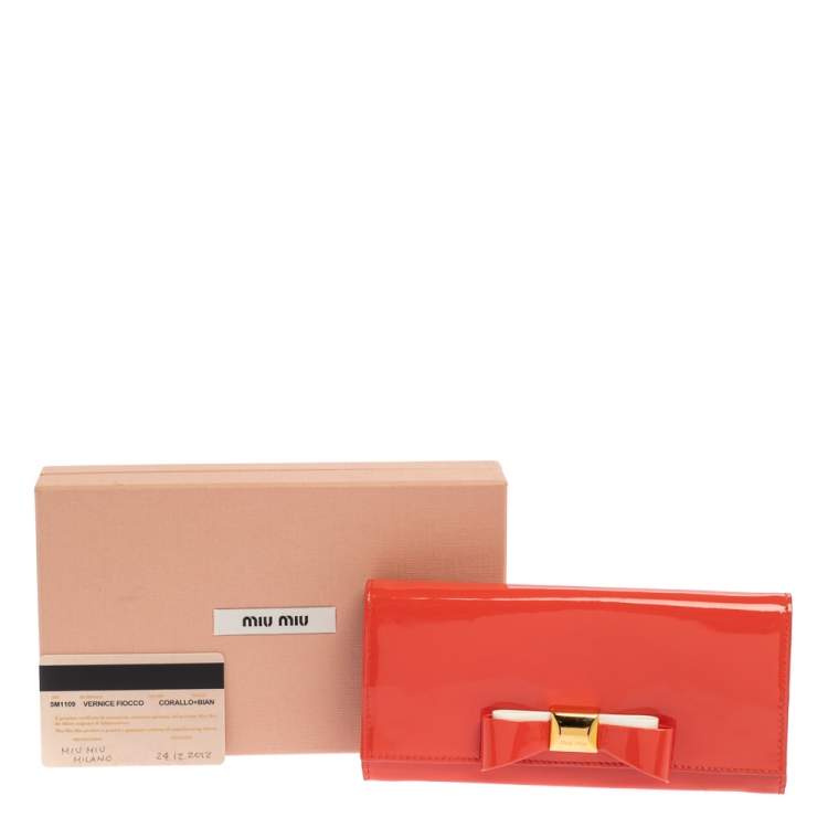 Pre Owned Miu Miu Coral Orange Vernice Leather Bow Flap Continental Wallet