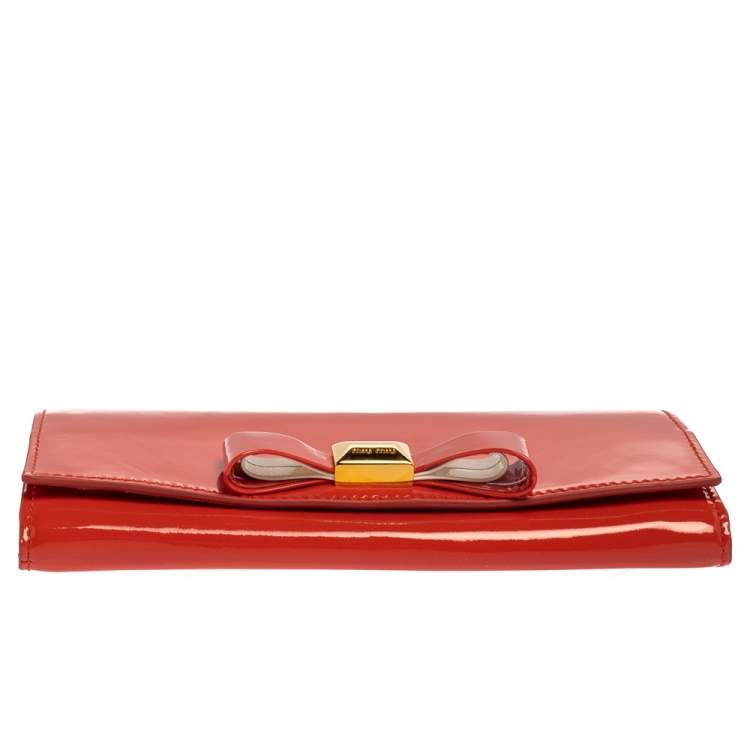Pre Owned Miu Miu Coral Orange Vernice Leather Bow Flap Continental Wallet