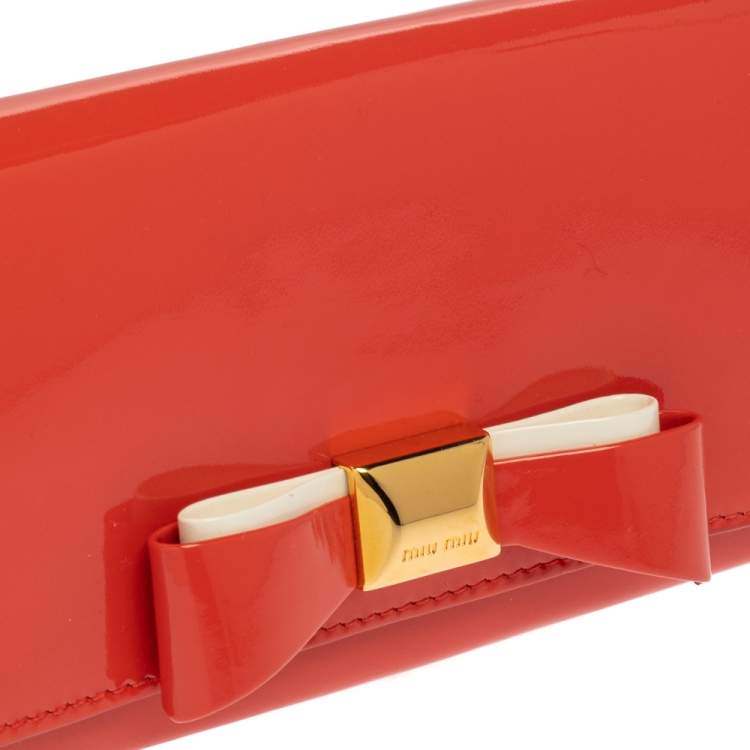 Pre Owned Miu Miu Coral Orange Vernice Leather Bow Flap Continental Wallet