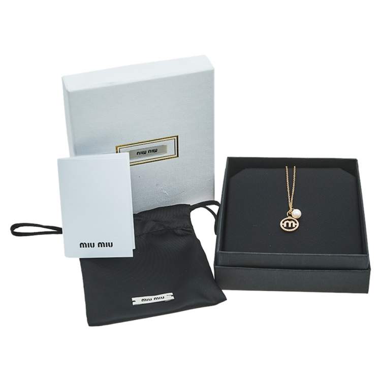 Pre Owned Miu Miu Crystal Logo and Faux Pearl Gold Tone Metal Pendant Necklace