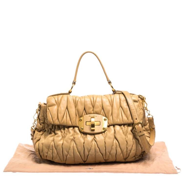 Pre Owned Miu Miu Beige Matelasse Leather Turnlock Top Handle Bag