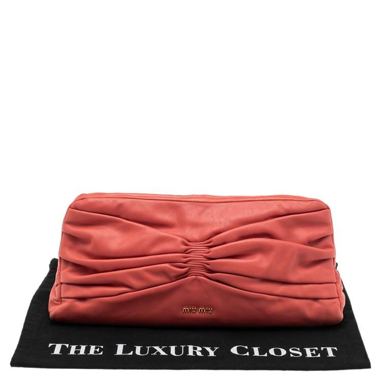 Pre Owned Miu Miu Coral Orange Leather Bow Kiss Lock Clutch