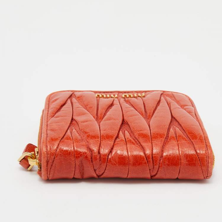 Pre Owned Miu Miu Orange Matelassé Leather Zip Around Compact Wallet