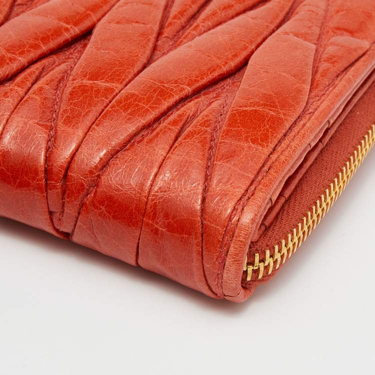 Pre Owned Miu Miu Orange Matelassé Leather Zip Around Compact Wallet