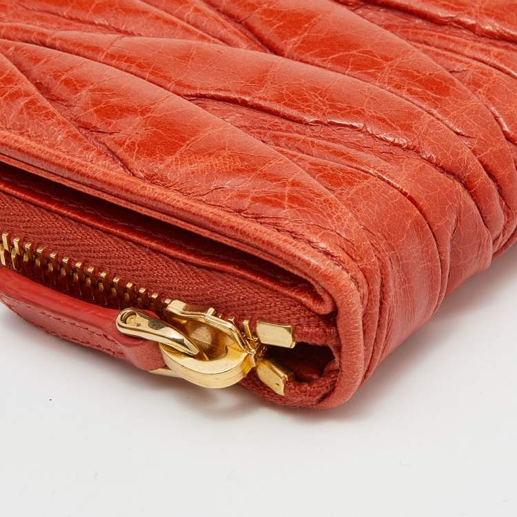 Pre Owned Miu Miu Orange Matelassé Leather Zip Around Compact Wallet