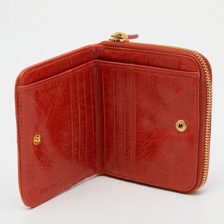 Pre Owned Miu Miu Orange Matelassé Leather Zip Around Compact Wallet