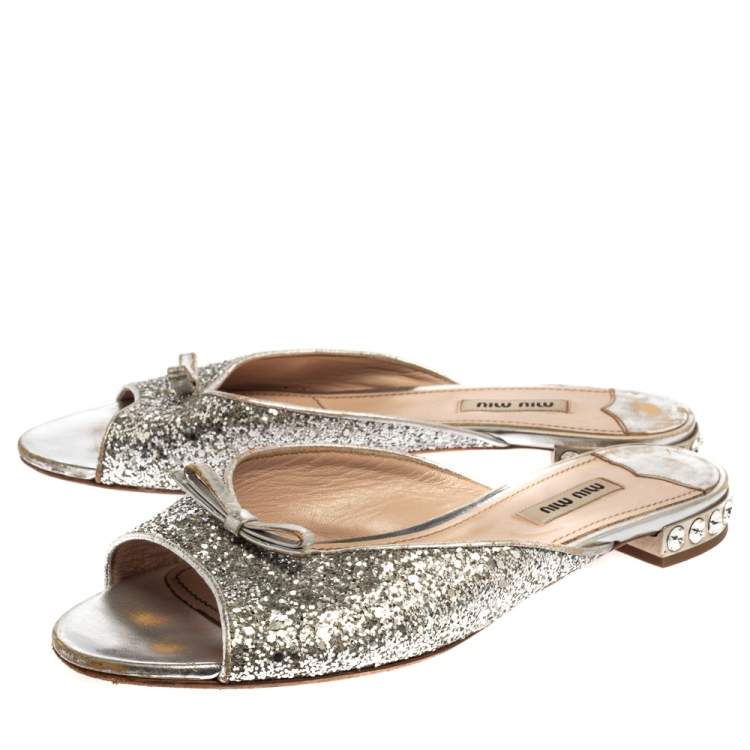 Pre Owned Miu Miu Metallic Silver Glitter Bow Detail Crystal Embellished Flat Slides Size 39