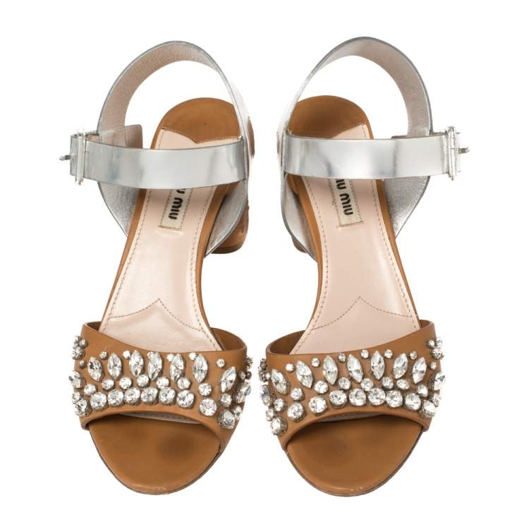 Pre Owned Miu Miu Brown/Metallic Silver Patent Leather and Leather Crystal Embellished Block Heel Ankle Strap Sandals Size 38.5