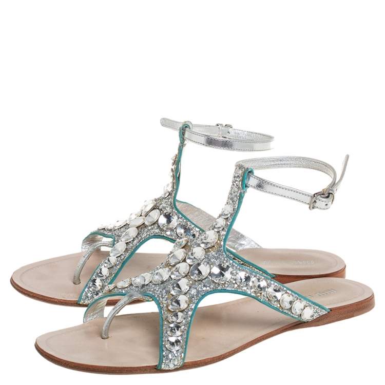 Pre Owned Miu Miu Silver Glitter And Leather Crystal Embellished Flat Ankle Strap Sandals Size 38