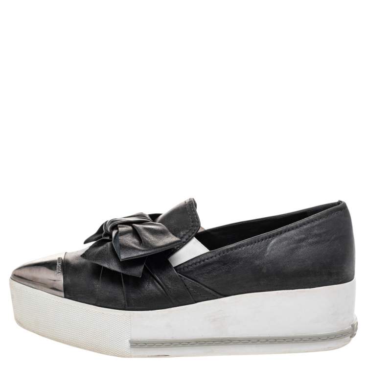 Pre Owned Miu Miu Black Leather Knot Bow Skate Metal Cap Toe Slip On Sneakers Size 38