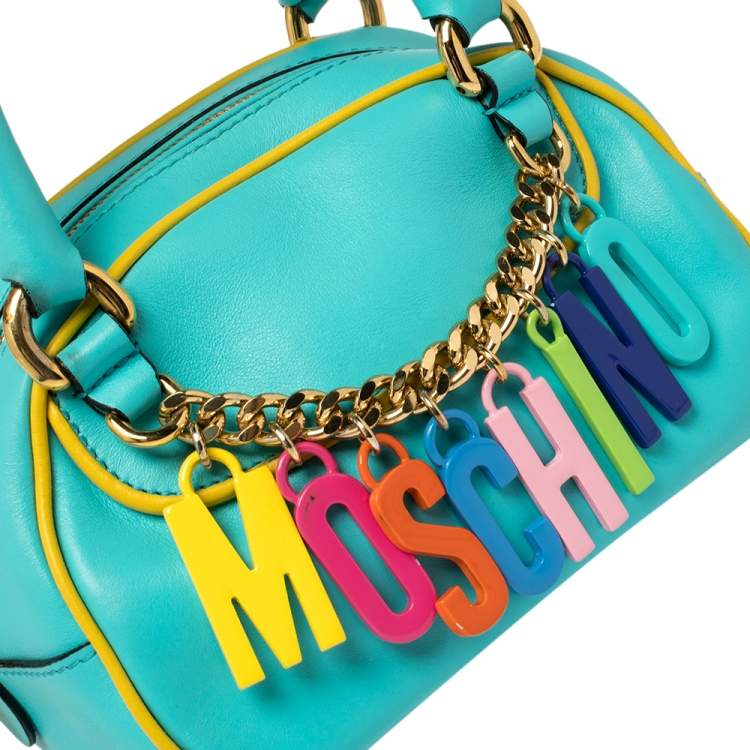 Pre Owned Moschino Turquoise/Yellow  Leather Logo Charm Satchel