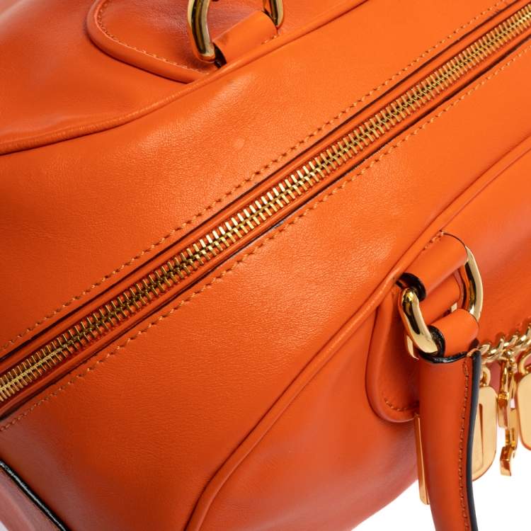 Pre Owned Moschino Orange Leather Logo Charm Bowling Bag